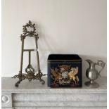 A Toleware hand painted metal bin/planter, H. 22cm, together with a brass easel, H. 54cm and a