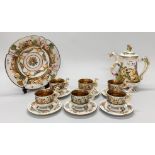 A Capodimonte coffee pot, six cups with saucers and fruit bowl, coffee pot H. 26cm.