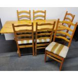 A pine kitchen table and six chairs, 152 x 68cm.