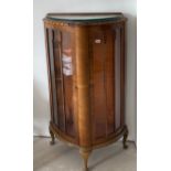 An Art Deco walnut veneered display cabinet, W. 78cm, H. 128cm.