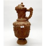 A large 19th century relief decorated pottery jug, H. 54cm.