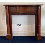 A 1920's mahogany fireplace surround, W. 138cm, H. 132cm, inset 89 x 93cm.