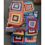 A group of vintage hand crotcheted blankets.