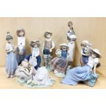 A group of seven Lladro and two Nao figures of girls, tallest H. 27cm.