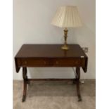 A reproduction mahogany sofa table.