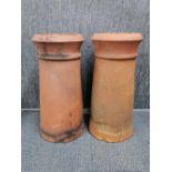 A pair of terracota chimney pots, H. 55cm.