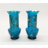 A pair of 19th century hand painted blue glass vases relief decorated with snakes, H. 20cm. One A/F