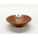 A Chinese Song dynasty (960-1279) style red/brown glazed pottery bowl relief decorated with