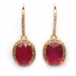 A pair of 925 silver rose gold gilt drop earrings set with oval cut ruby and white stones, L. 2.