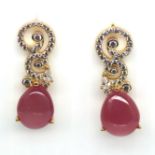 A pair of 925 silver gilt drop earrings set with cabochon pear cut rubies and white stones, L. 2.