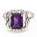 A 925 silver ring set with an emerald cut amethyst, (N).