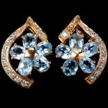 A pair of 925 silver rose gold gilt earrings set with oval cut blue topaz, L. 2cm.