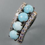 A 925 silver ring set with cabochon cut turquoise and tanzanites, (N).