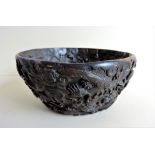 Chinese relief decorated Dragon Bowl. The bowl is hand decorated with dragons, urns and