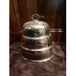 A set of three silver plated food covers, largest W. 39cm.