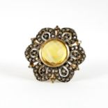 A 9ct yellow gold flower shaped ring set with a faceted citrine and fancy yellow diamonds, (N), Dia.