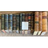 Thirteen large leather and half leather bound volumes of 'Webster's dictionary', 'History of