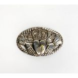 A heavy hallmarked silver claddagh design nurse's buckle, W. 9cm.