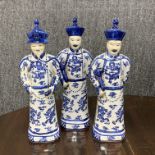 A set of three large Chinese porcelain figures of Mandarin, H. 41cm.