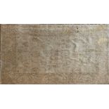 A cream ground Eastern wool rug, 180 x 274cm. Condition: slight discolouration.