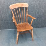 A 19th century slat back beechwood kitchen chair, H. 103cm.