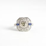 An Art Deco style 18ct white gold (stamped 18k) ring set with a brilliant cut centre diamond