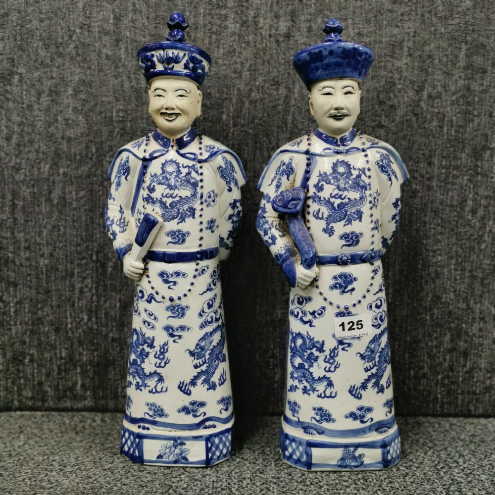 A pair of Chinese porcelain figures of Mandarins, H. 45cm.