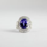 An 18ct white gold (stamped 750) ring set with a large oval cut tanzanite and brilliant cut