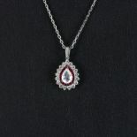 An 18ct white gold (stamped 750) pendant and chain set with a rose pear cut diamond, rubies and
