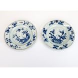 A pair of 18th century Chinese export porcelain plates, one with glaze crack, Dia. 22cm.