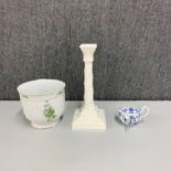 A Royal Worcester porcelain candlestick, H. 27cm, together with a porcelain invalid feeder.