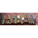A large group of mixed antique and later cloth and leatherbound books, largest H. 25cm.