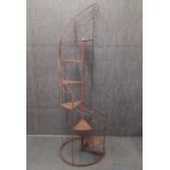 A wrought iron plant pot staircase, H. 165cm Dia. 53cm.