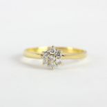An 18ct yellow gold diamond set cluster ring, (P).