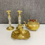 A pair of crystal and brass candlesticks, H. 25cm, together with a brass chamber stick and a brass