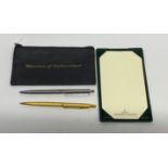 A Rolex advertising desk notepad with gold plated Parker pen and Watches of Switzerland case.
