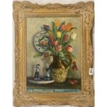 A gilt framed oil on board depicting a still life, signed K. Charles, frame size 80 x 90cm.