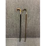 Two silver mounted horn handled walking sticks.