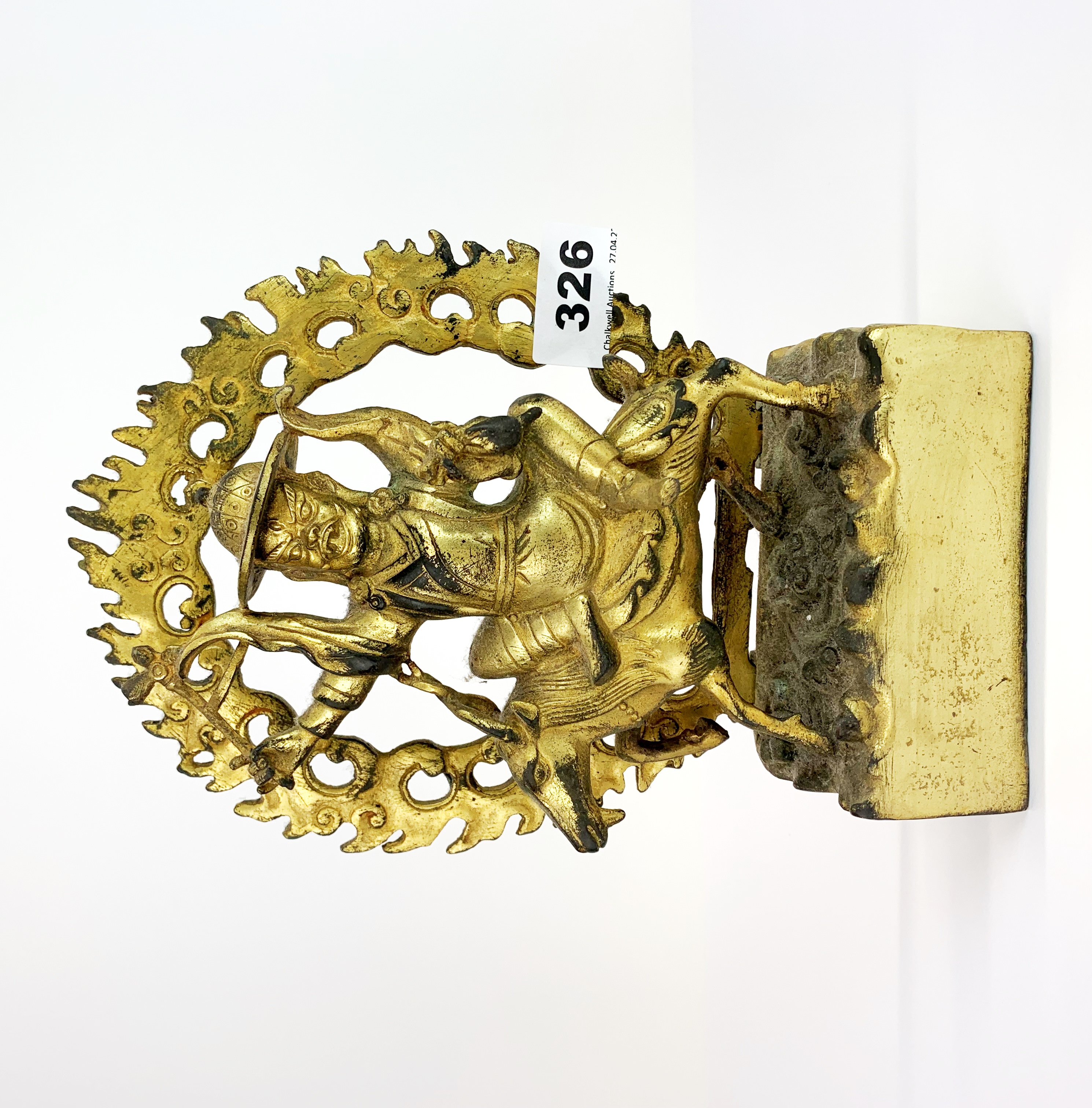 A Tibetan gilt bronze figure of a Buddhist deity, H. 23cm.