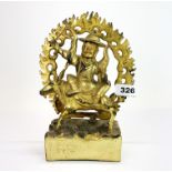 A Tibetan gilt bronze figure of a Buddhist deity, H. 23cm.