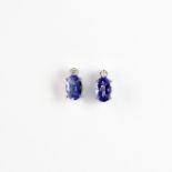 A pair of 9ct yellow gold stud earrings set with oval cut tanzanites an brilliant cut diamonds, L.
