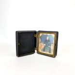 A 19th century vulcanite cased handpainted photograph portrait of a young man (A/F), 8.5 x 9.5 x