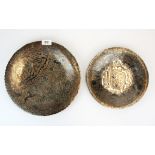 Two Eastern silver decorated hammered copper plates, largest Dia. 29cm.