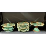 An extensive 19th century leaf design Majolica fruit set, comprising twelve plates and three