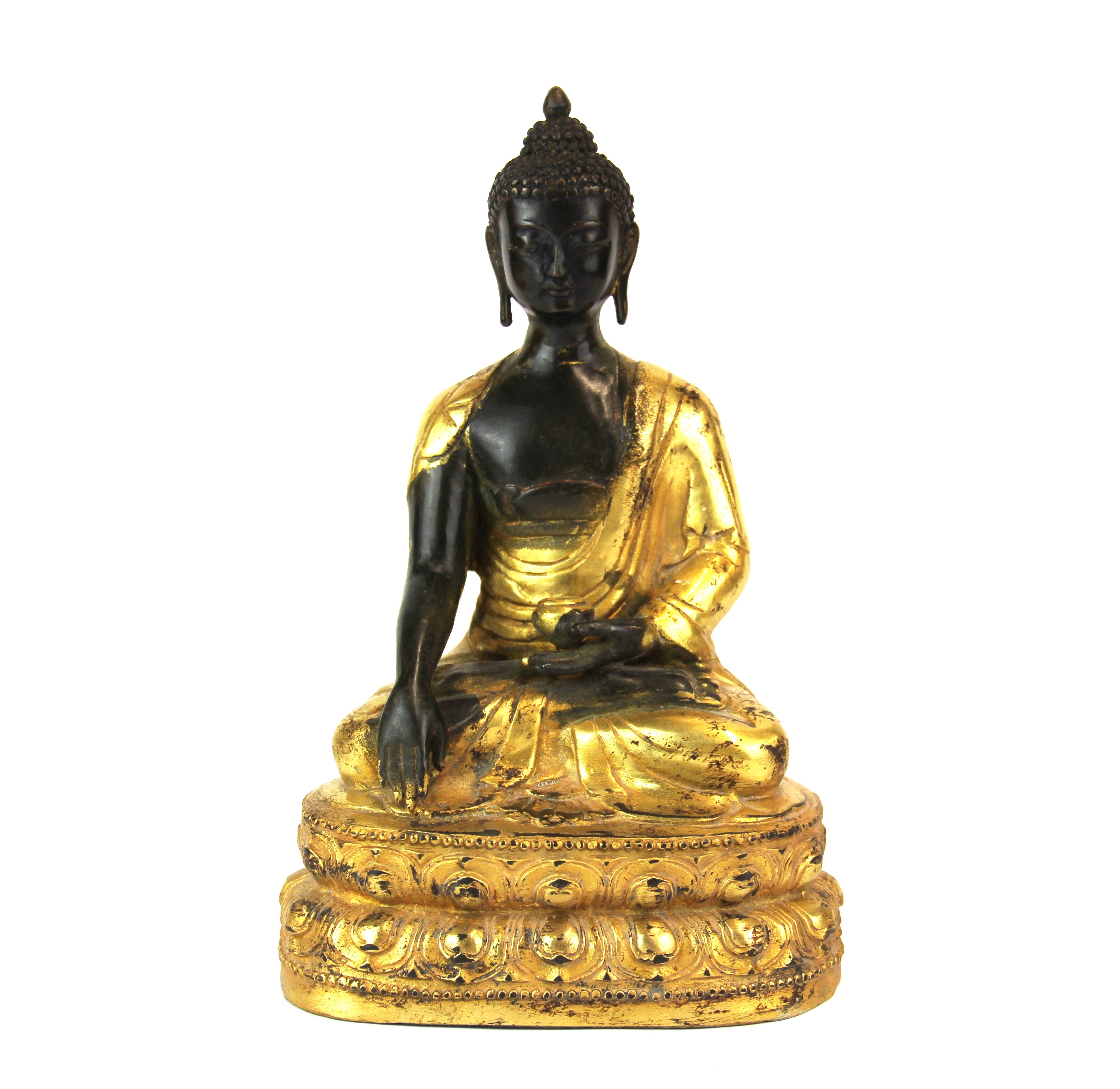 A Tibetan gilt bronze figure of a seated Buddha, H. 23cm.