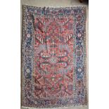 A large hand woven Turkish wool rug, 207 x 305cm.