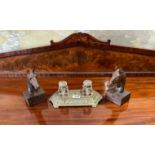 A Victorian brass desk stand with cut glass ink wells and a pair of horse head desk decorations,