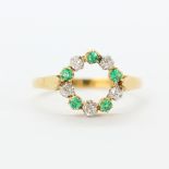 An antique French 18ct yellow gold and platinum ring set with old cut diamonds and emeralds, (P),