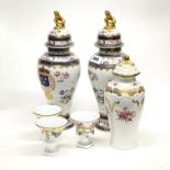 A pair of oriental style French porcelain jars and lids together with a further porcelain jar and