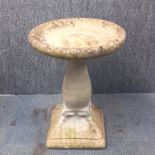 A concrete garden bird bath, 64 x 49cm.